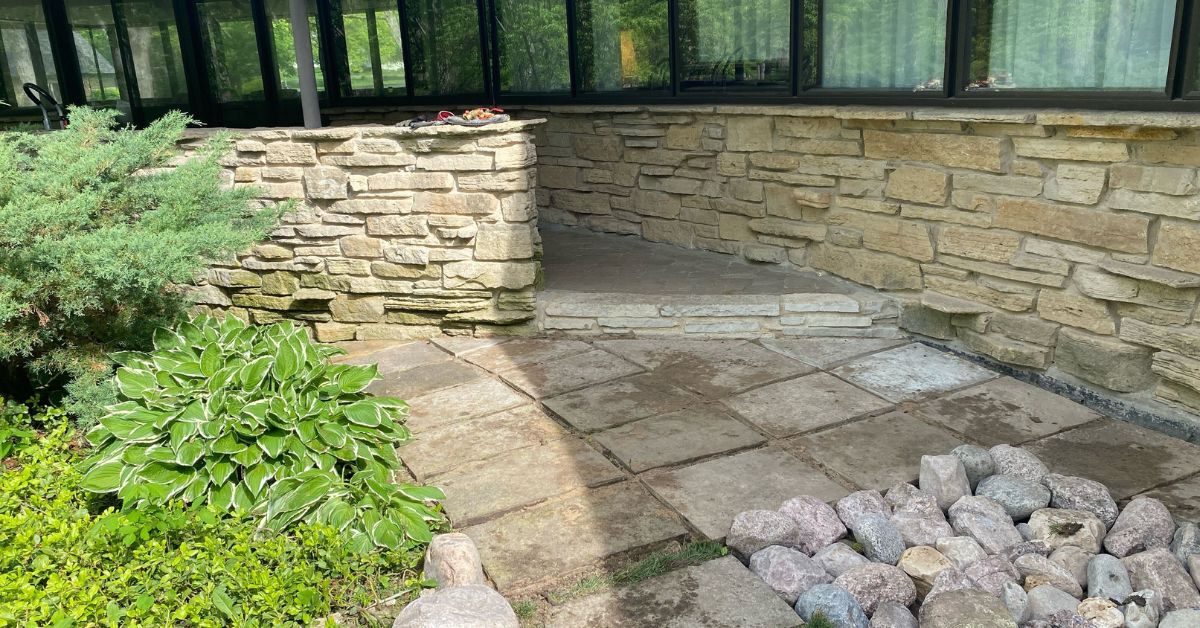 Backyard drainage and lawn restoration project in Barrington featuring French drain installation, grading corrections, PVC drainage piping, fresh sod installation, and backyard water management improvements