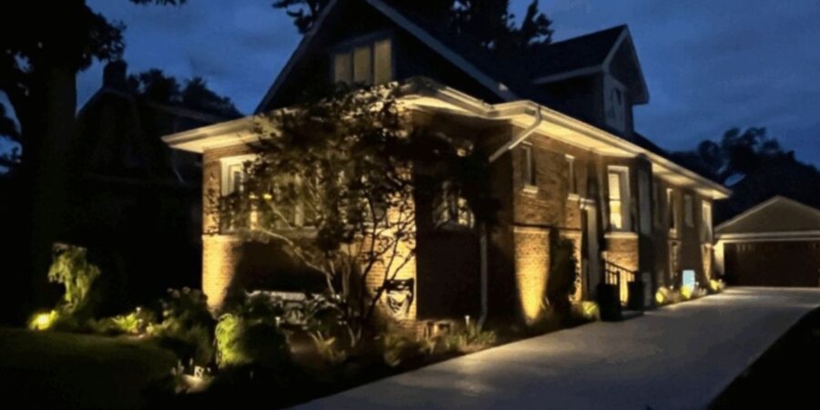 Wilmette property with new NDS drainage, underground irrigation, custom turf, fresh sod, hundreds of trees and shrubs, and Kichler landscape lighting throughout.