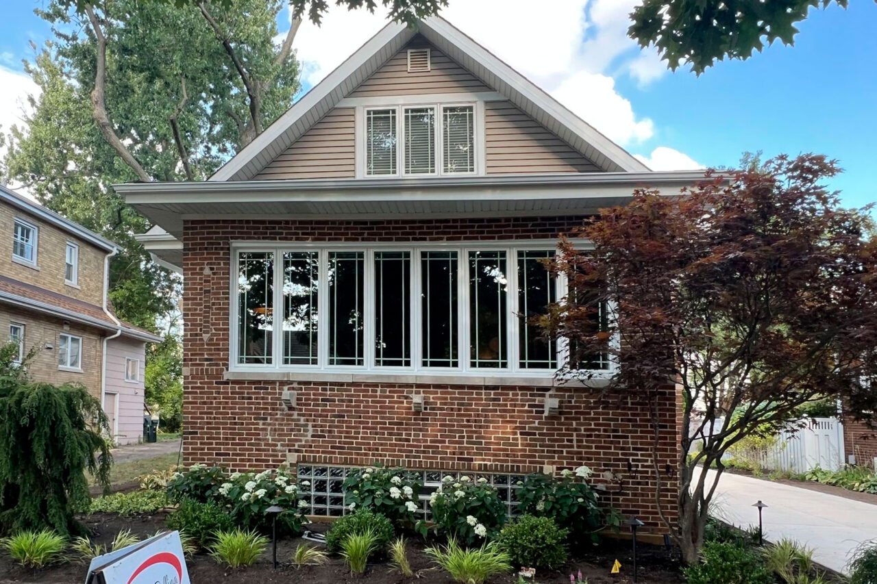 Complete outdoor makeover in Park Ridge with grading, NDS drainage, artificial turf, lighting, plants, and hardscapes