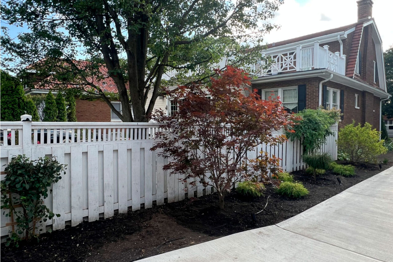 Complete outdoor makeover in Park Ridge with grading, NDS drainage, artificial turf, lighting, plants, and hardscapes