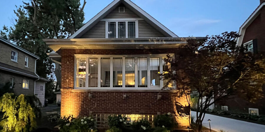 Complete outdoor makeover in Park Ridge with grading, NDS drainage, artificial turf, lighting, plants, and hardscapes