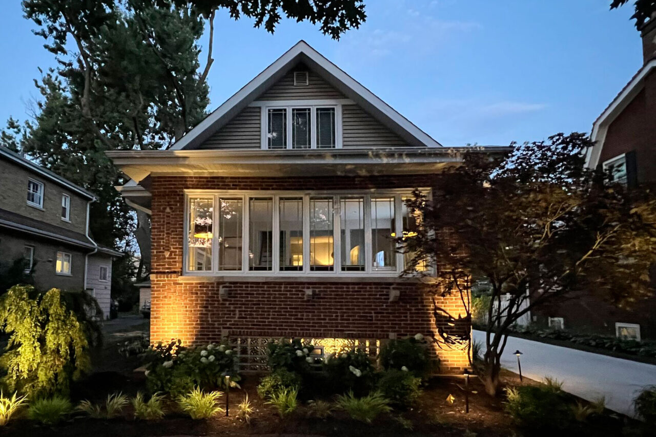 Complete outdoor makeover in Park Ridge with grading, NDS drainage, artificial turf, lighting, plants, and hardscapes