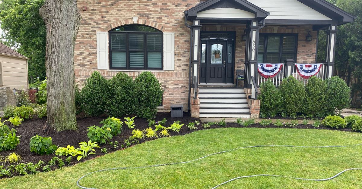 Front and backyard landscape renovation in Winnetka, IL featuring new perennial plantings, flowering shrubs, compost-amended beds, and enhanced curb appeal.