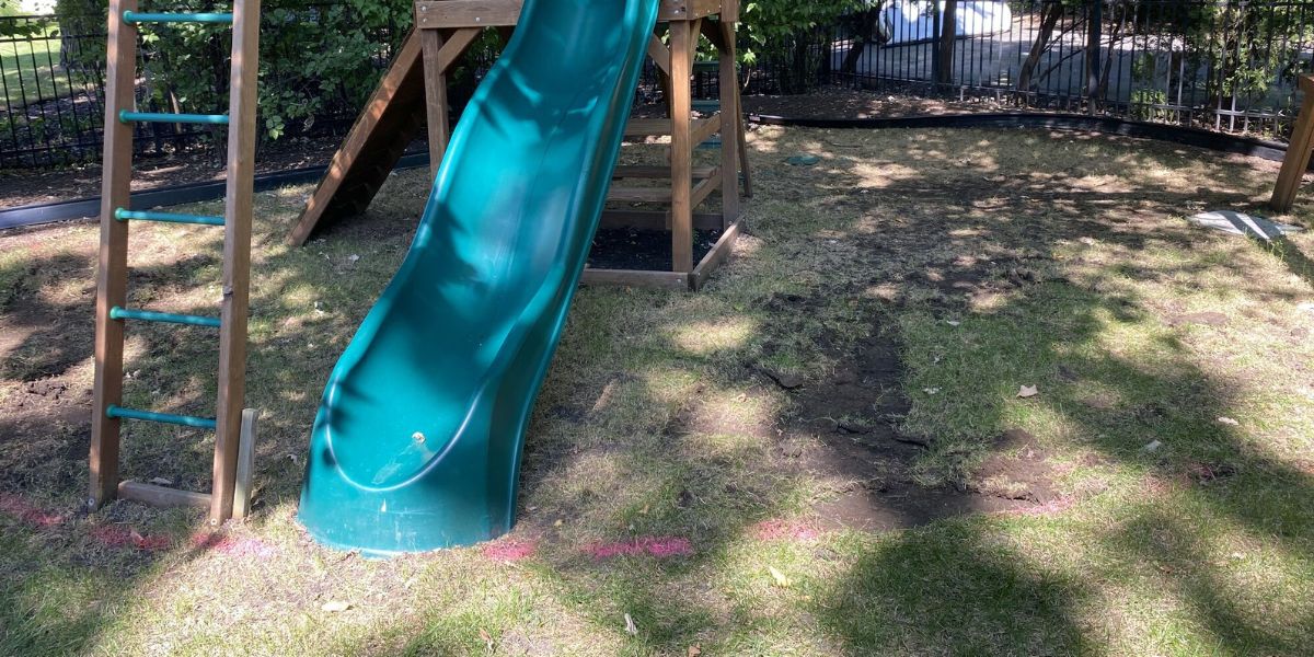 Inverness playground upgrade with regraded play area and fresh mulch for safer, cleaner landscaping in this family project.