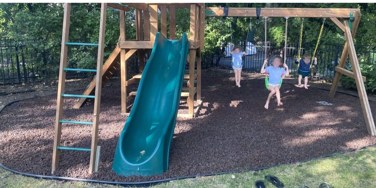 Inverness playground upgrade with regraded play area and fresh mulch for safer, cleaner landscaping in this family project.