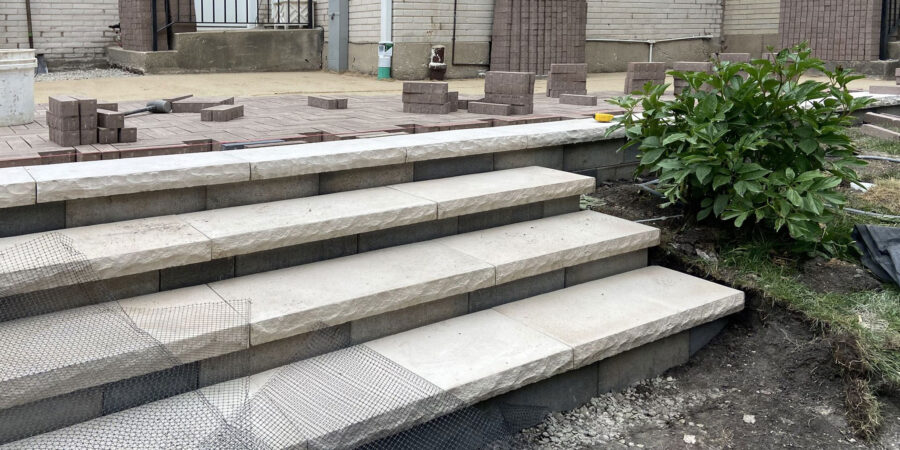 Wilmette Design Build Hardscape Renovation with Unilock Pavers, Custom Railings, and Integrated Drainage