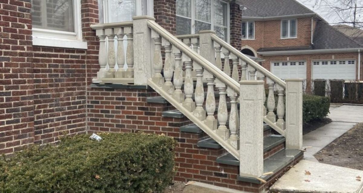 Front entrance stairs and raised back patio with custom masonry, showcasing design-build solutions and expert craftsmanship.