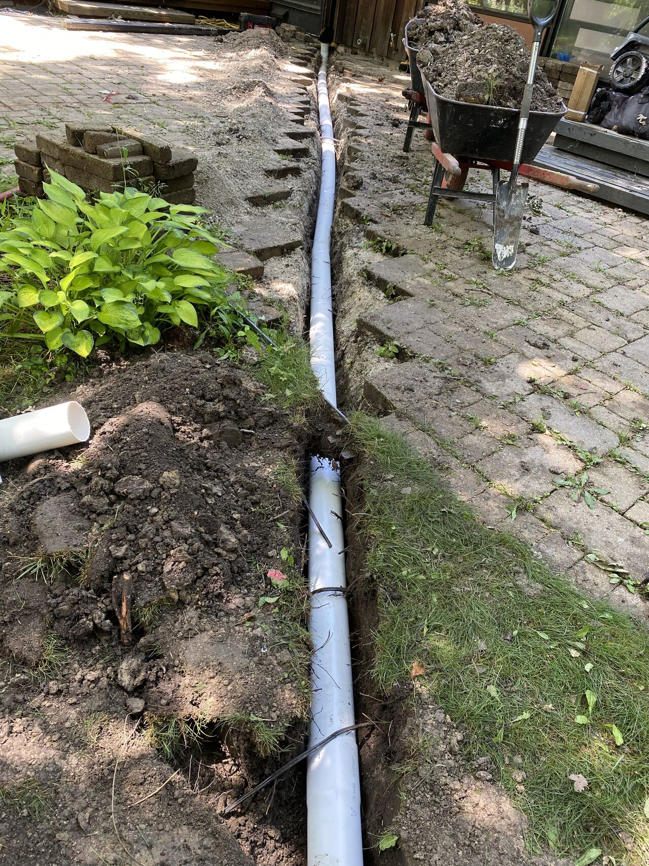 Trench installation of underground pipe shows professional Drainage Upgrades designed to prevent flooding and protect Park Ridge homes.