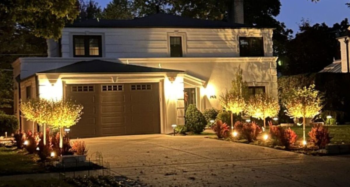 Professional landscape lighting in Park Ridge featuring Kichler fixtures enhancing home security, visibility, and nighttime curb appeal.