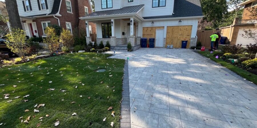 Wilmette New Construction Landscaping with Bluestone Porch, Unilock Pavers, Deck, Sod, Irrigation, and Drainage Systems